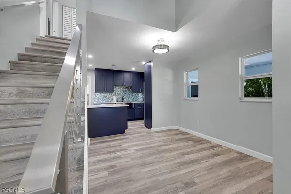 a view of kitchen and wooden floor