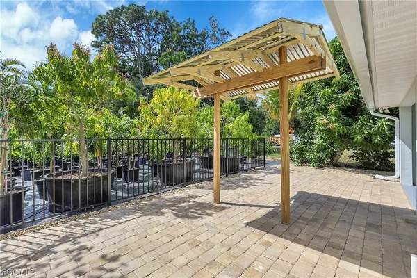 a view of a street with wooden fence
