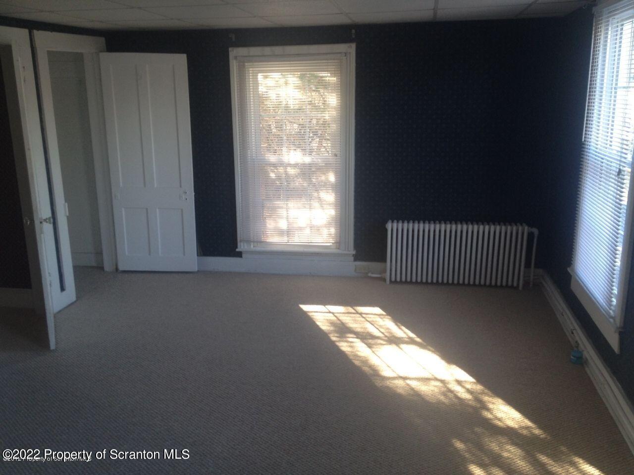214 Main Street Moosic, PA 18507 - Photo 11 of 19 a view of an empty room and window