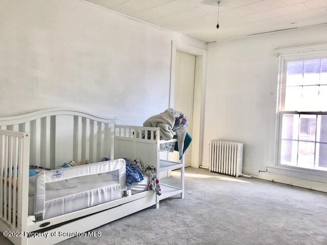 214 Main Street Moosic, PA 18507 - Photo 12 of 19 a bedroom with a bed and a window