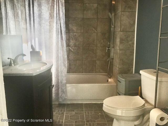 214 Main Street Moosic, PA 18507 - Photo 17 of 19 a bathroom with a toilet a sink and bathtub