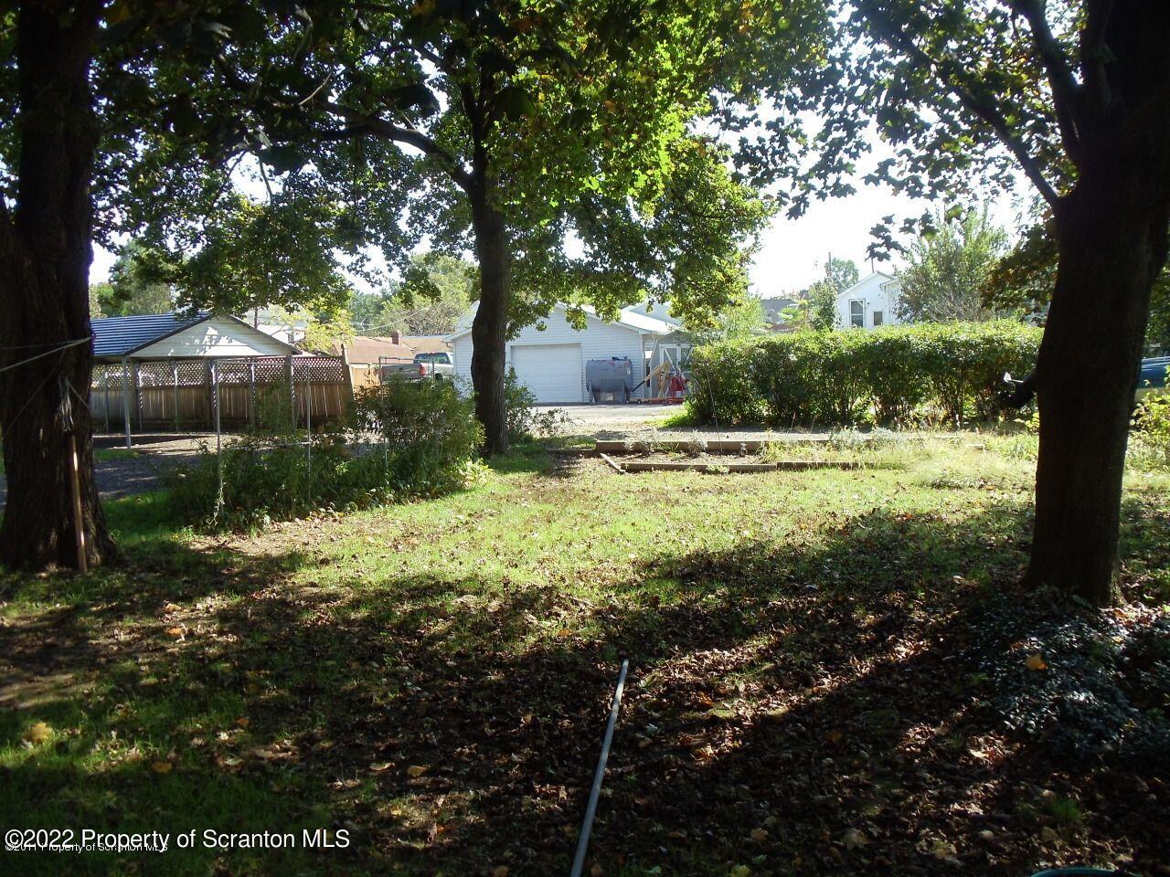 214 Main Street Moosic, PA 18507 - Photo 18 of 19 a backyard of a house with lots of green space