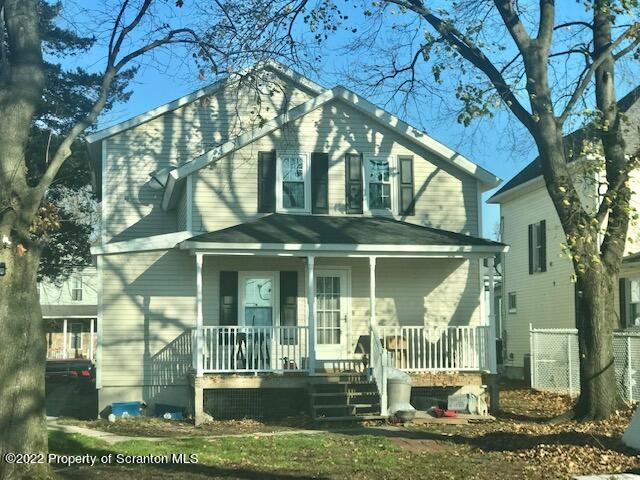 214 Main Street Moosic, PA 18507 - Photo 19 of 19 a front view of a house with a garden
