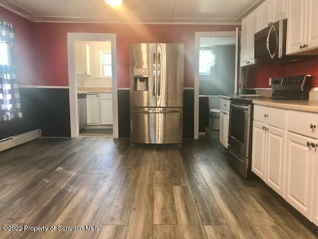 214 Main Street Moosic, PA 18507 - Photo 3 of 19 a kitchen with a refrigerator a sink and dishwasher a oven with wooden floor