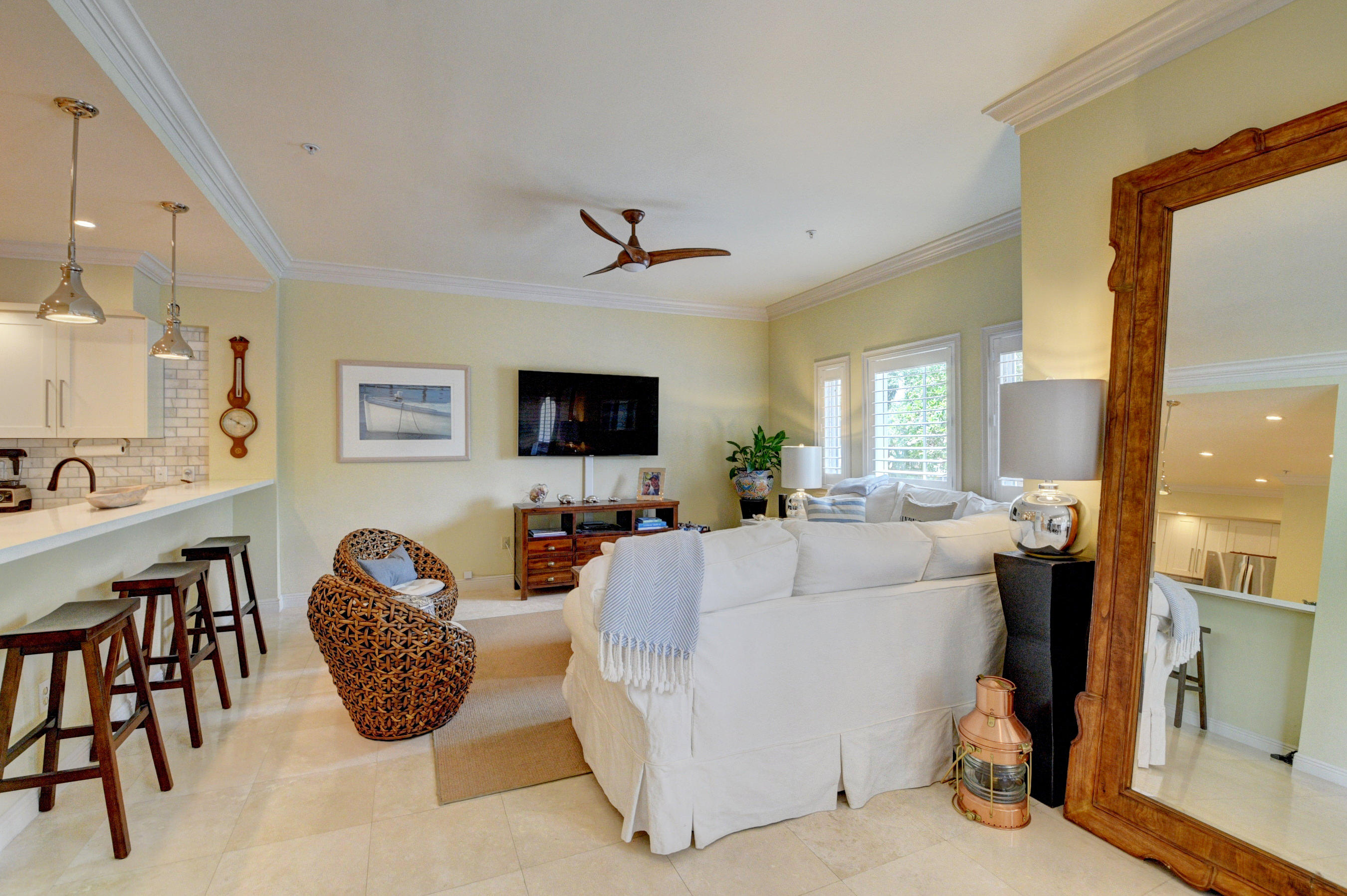 492 East Boca Raton Road Boca Raton, FL 33432 - Photo 13 of 44 a living room with furniture a flat screen tv and a large window