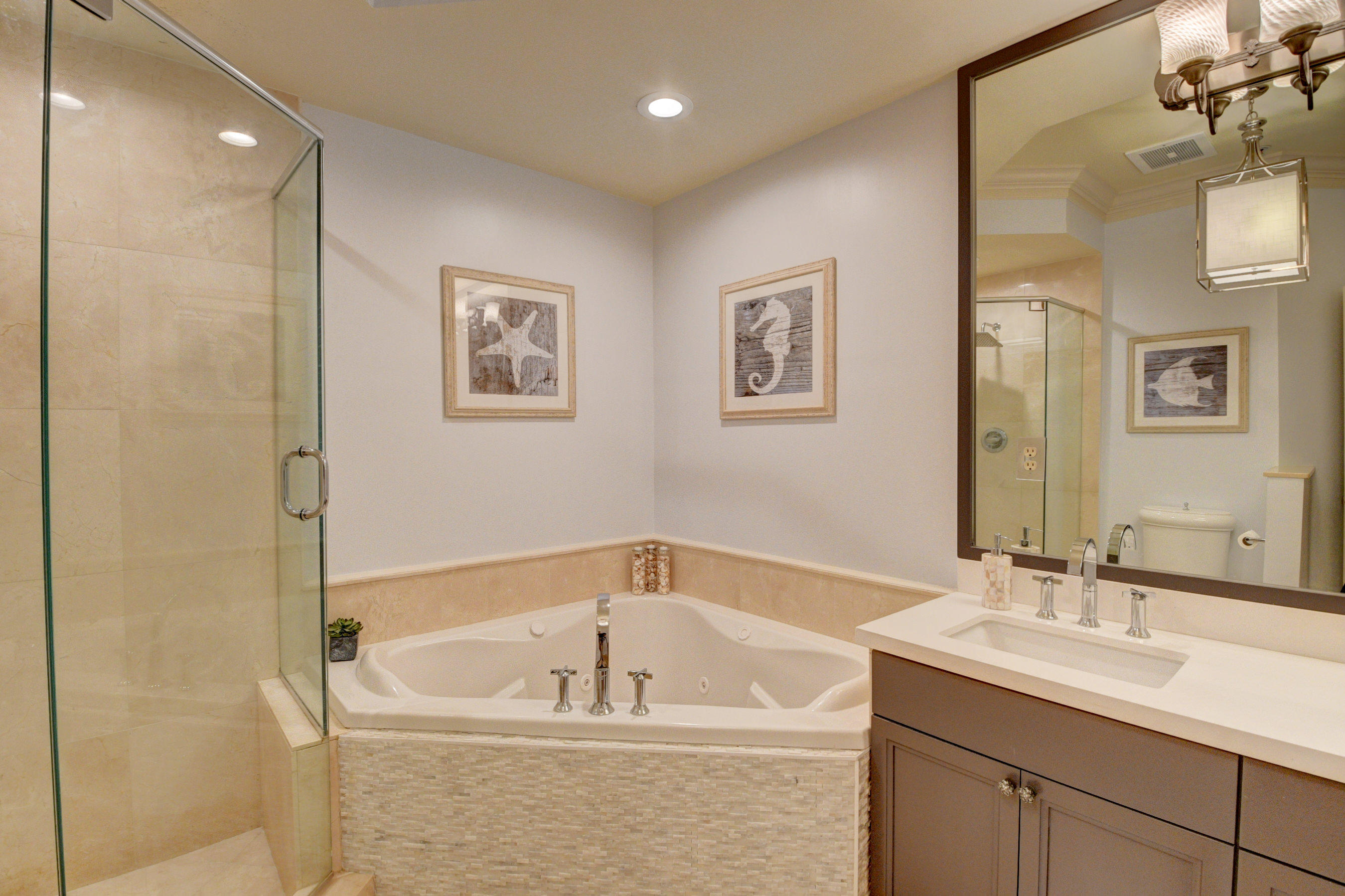 492 East Boca Raton Road Boca Raton, FL 33432 - Photo 28 of 44 a white bath tub sitting next to a bathroom sink