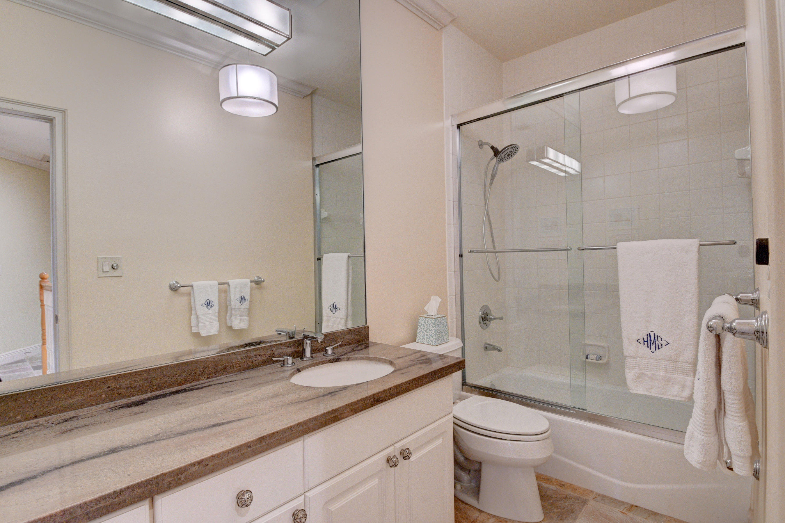 492 East Boca Raton Road Boca Raton, FL 33432 - Photo 35 of 44 a bathroom with a granite countertop sink toilet and shower