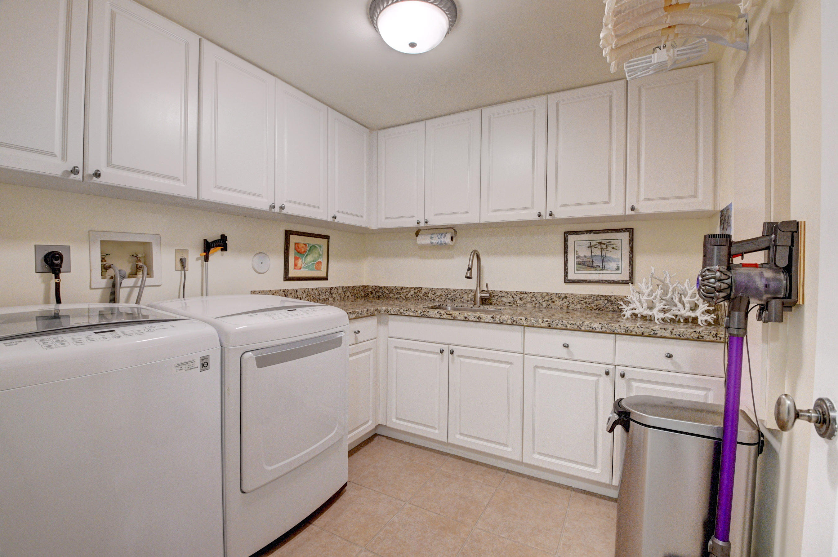 492 East Boca Raton Road Boca Raton, FL 33432 - Photo 8 of 44 a kitchen with sink cabinets and microwave