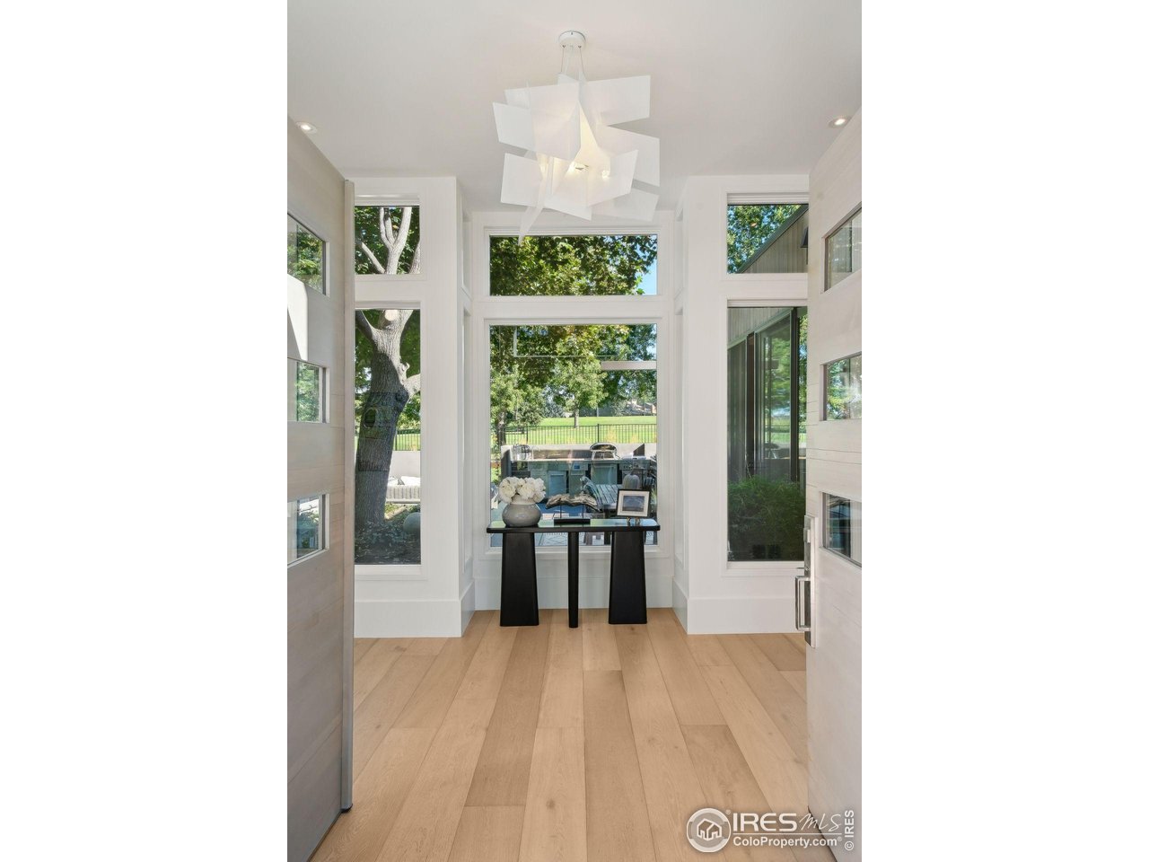 7323 Old Post Road Boulder, CO 80301 - Photo 13 of 40 Modern foyer and chandelier.