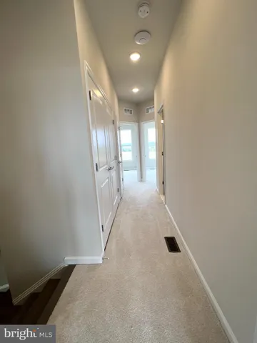 a view of hallway with stairs