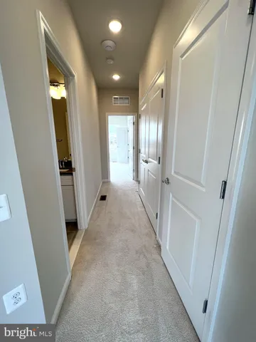 wooden floor with a bathroom