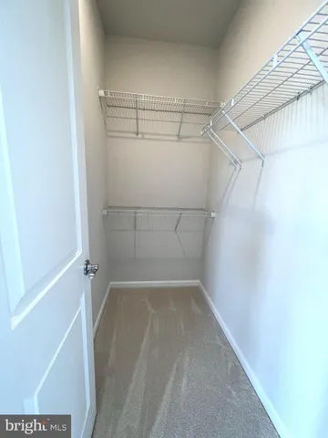 a view of a room with racks on the wall