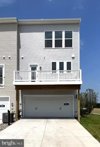 a front view of a house with a garage