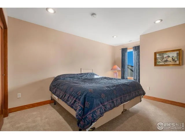 a kitchen with kitchen island a stove a sink a counter top space and living room view
