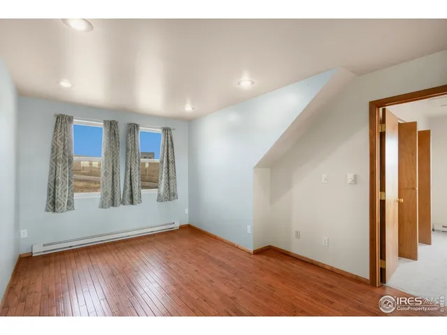 a view of a house with a garden and yard