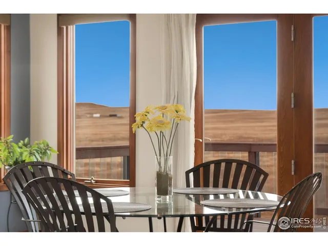 a dining room with furniture window wooden floor