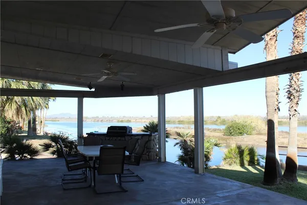 a view of living room with furniture and floor to ceiling window