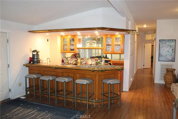 a very nice looking dining room with wooden floor and a large window
