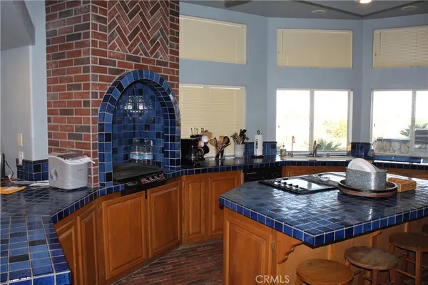 a kitchen with a stove and a sink