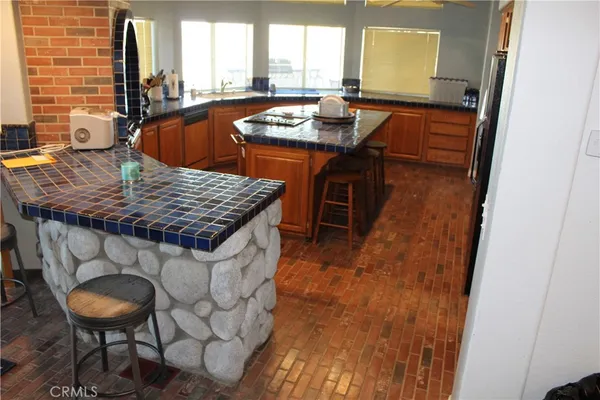 a dining table with chairs and window