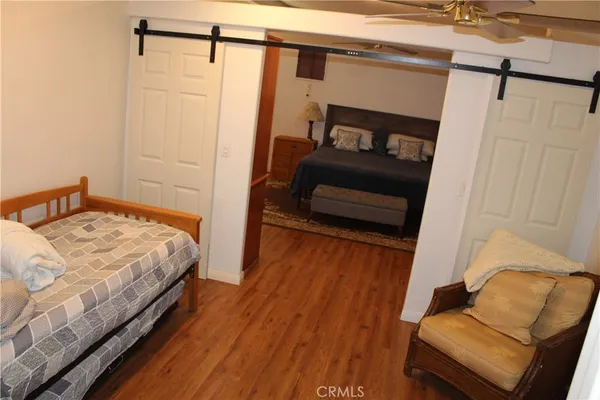 a bedroom with a bed and a couch