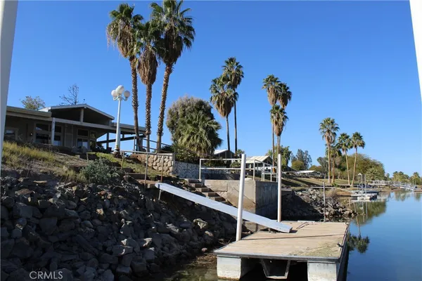 a view of a house with lake view and a potted plants