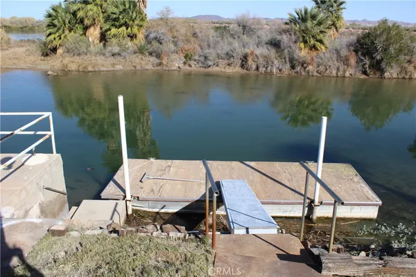 swimming pool view with a lake view