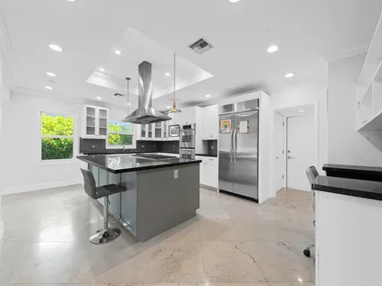 a kitchen with counter top space cabinets and stainless steel appliances