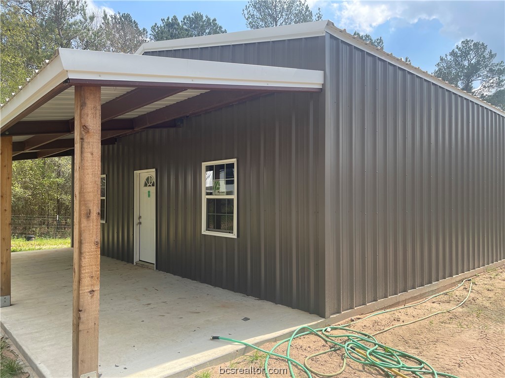 a view of backyard with cabin