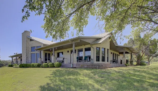 a view of a house with a big yard