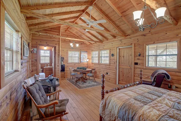 a green field with lots of trees in it