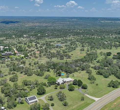 an aerial view of residential house with outdoor space