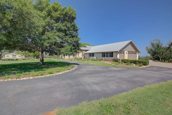 a view of garage and yard