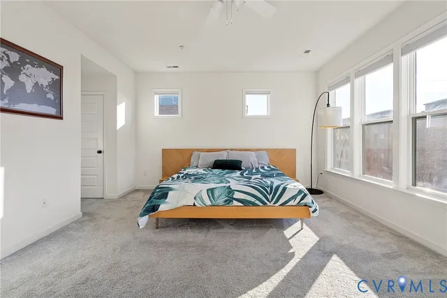 a bathroom with a granite countertop sink a toilet and shower