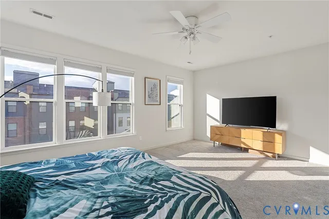 a large bathroom with double sink and a shower