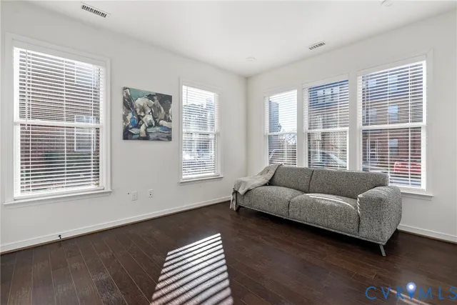 a living room with furniture and windows