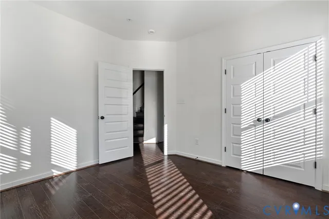 an empty room with wooden floor