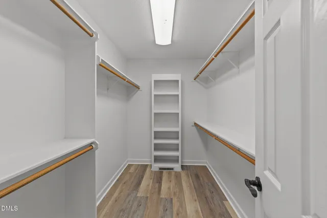 a view of an empty walk in closet