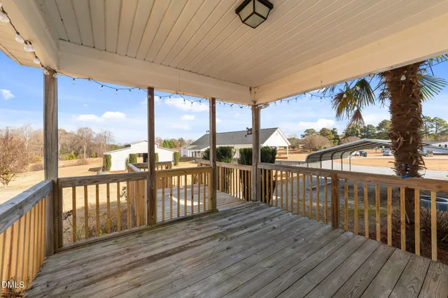 a view of a balcony with wooden floor