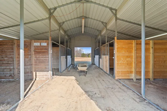 a view of a porch with a table and chairs
