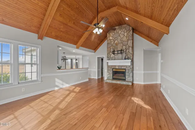 a view of livingroom with hardwood floor and kitchen view