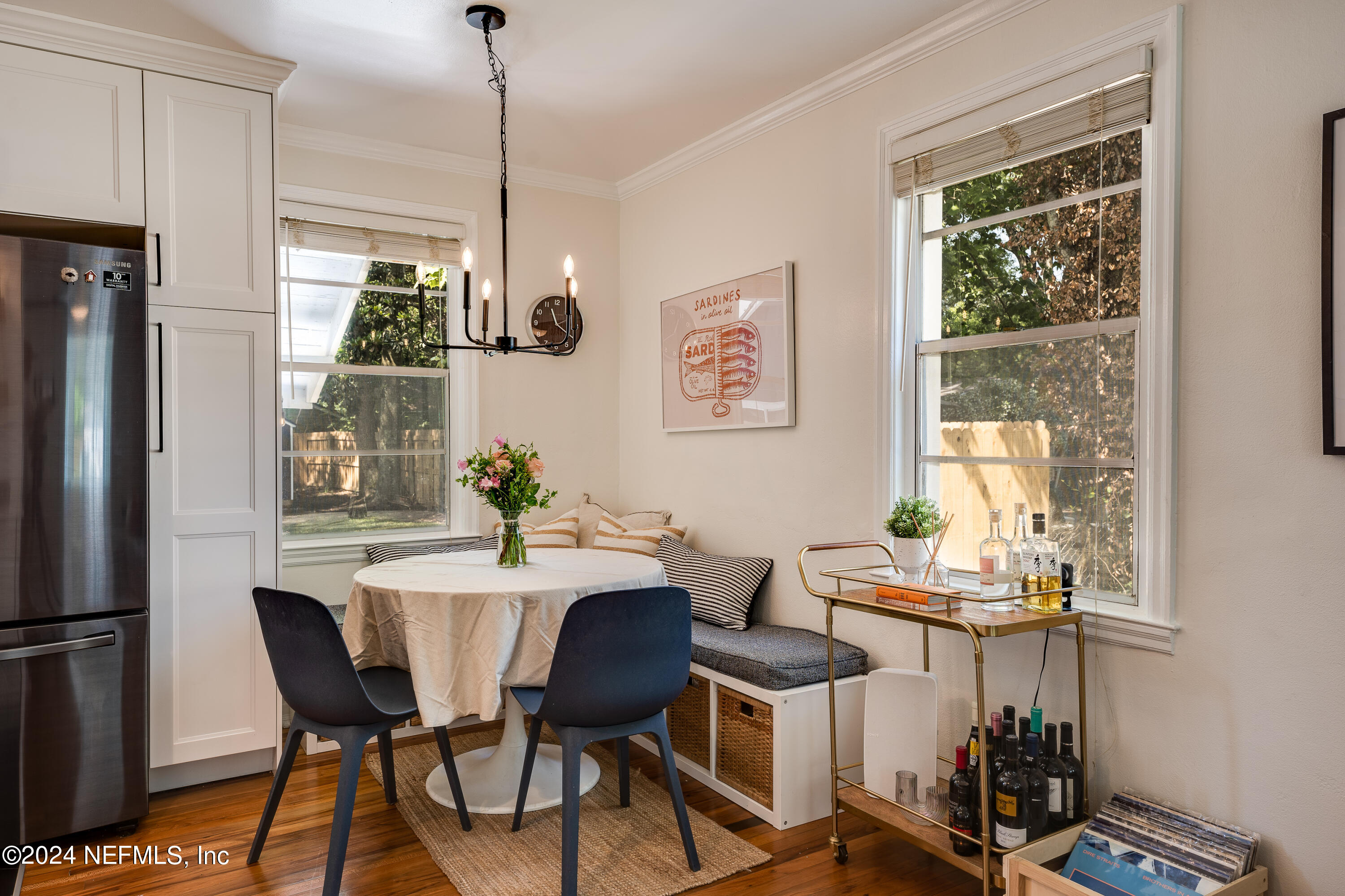 1322 Rensselaer Avenue Jacksonville, FL 32205 - Photo 11 of 37 a dining room with furniture a chandelier and wooden floor