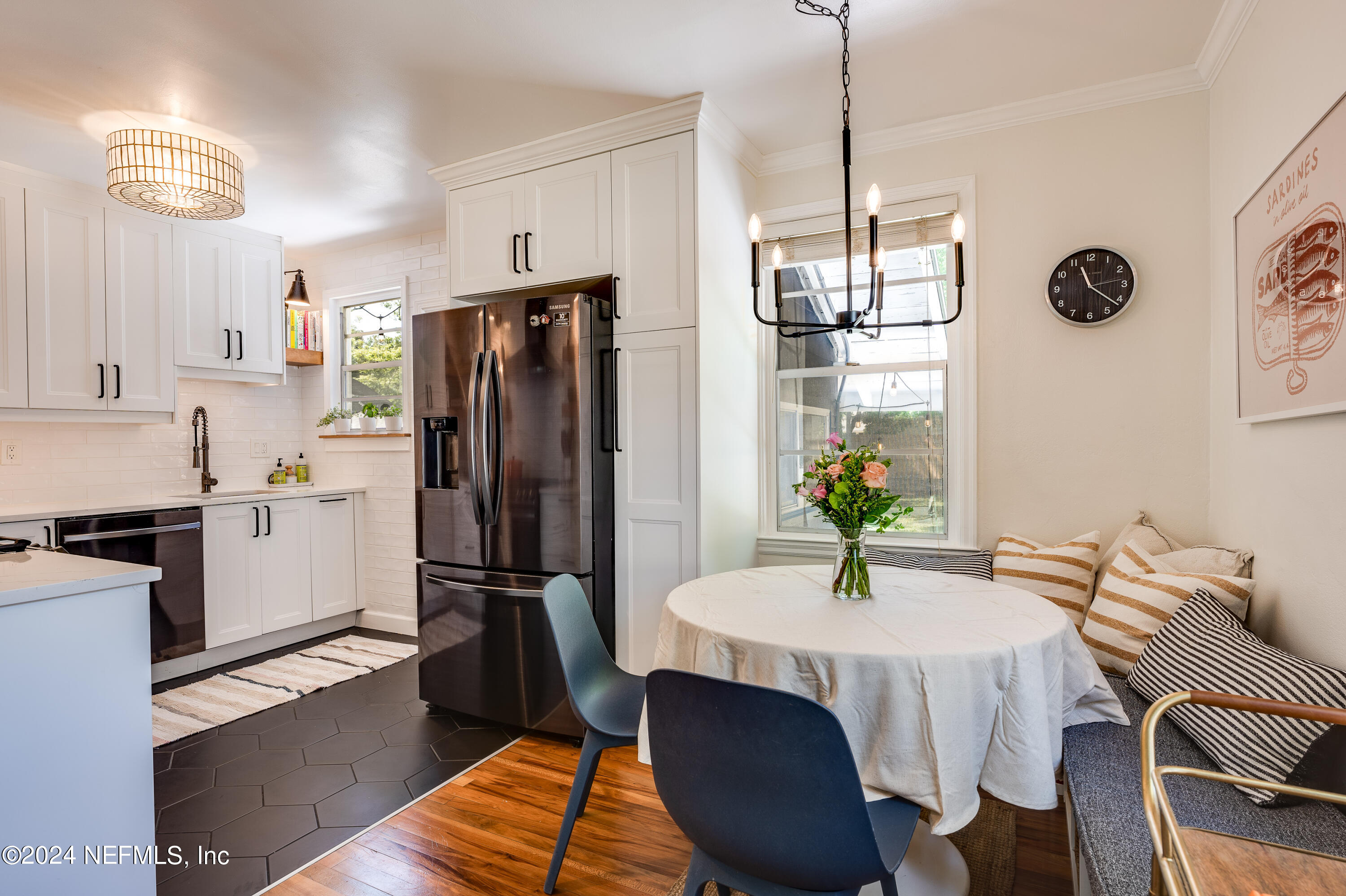 1322 Rensselaer Avenue Jacksonville, FL 32205 - Photo 12 of 37 a kitchen with stainless steel appliances a dining table chairs and chandelier