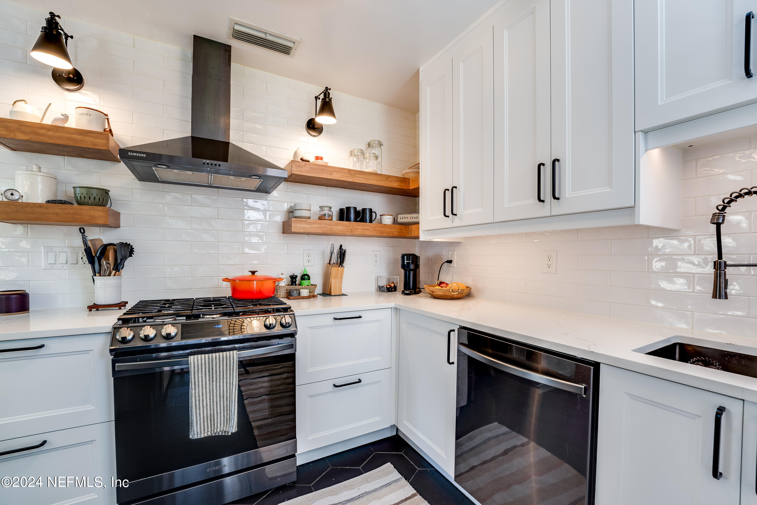 1322 Rensselaer Avenue Jacksonville, FL 32205 - Photo 15 of 37 a kitchen with stainless steel appliances granite countertop a sink a stove and cabinets