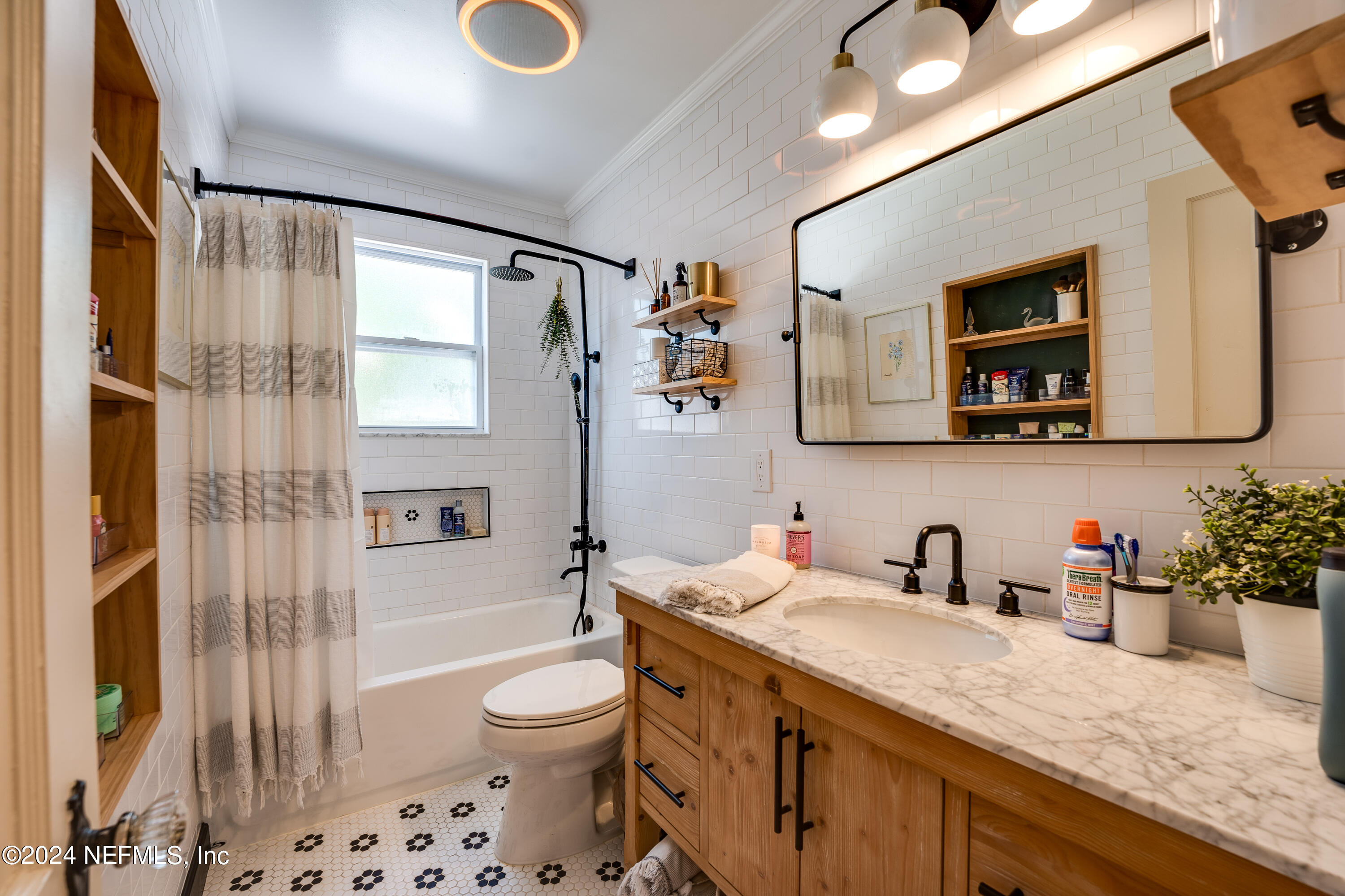 1322 Rensselaer Avenue Jacksonville, FL 32205 - Photo 23 of 37 a bathroom with a granite countertop sink mirror vanity and toilet