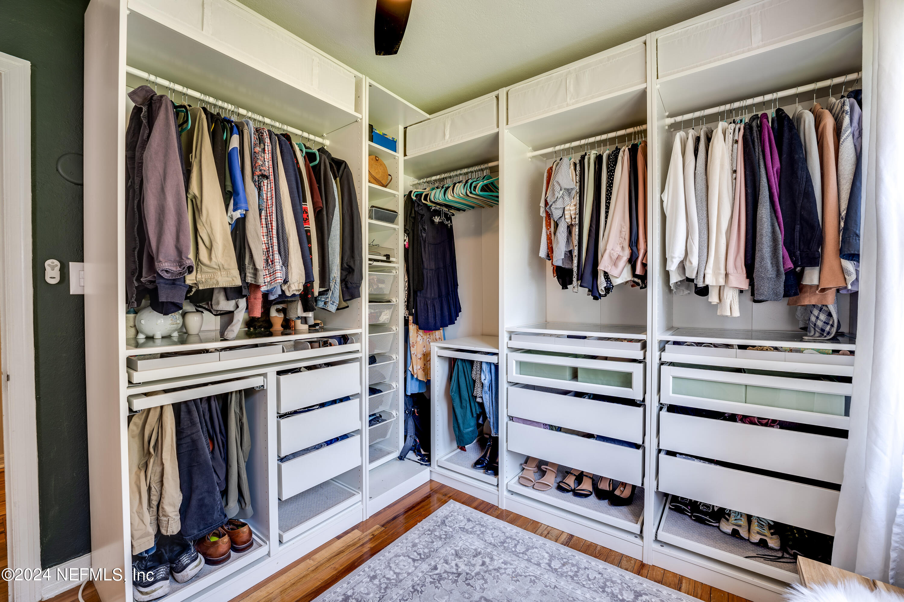 1322 Rensselaer Avenue Jacksonville, FL 32205 - Photo 25 of 37 a view of walk in closet with clothes and shoes
