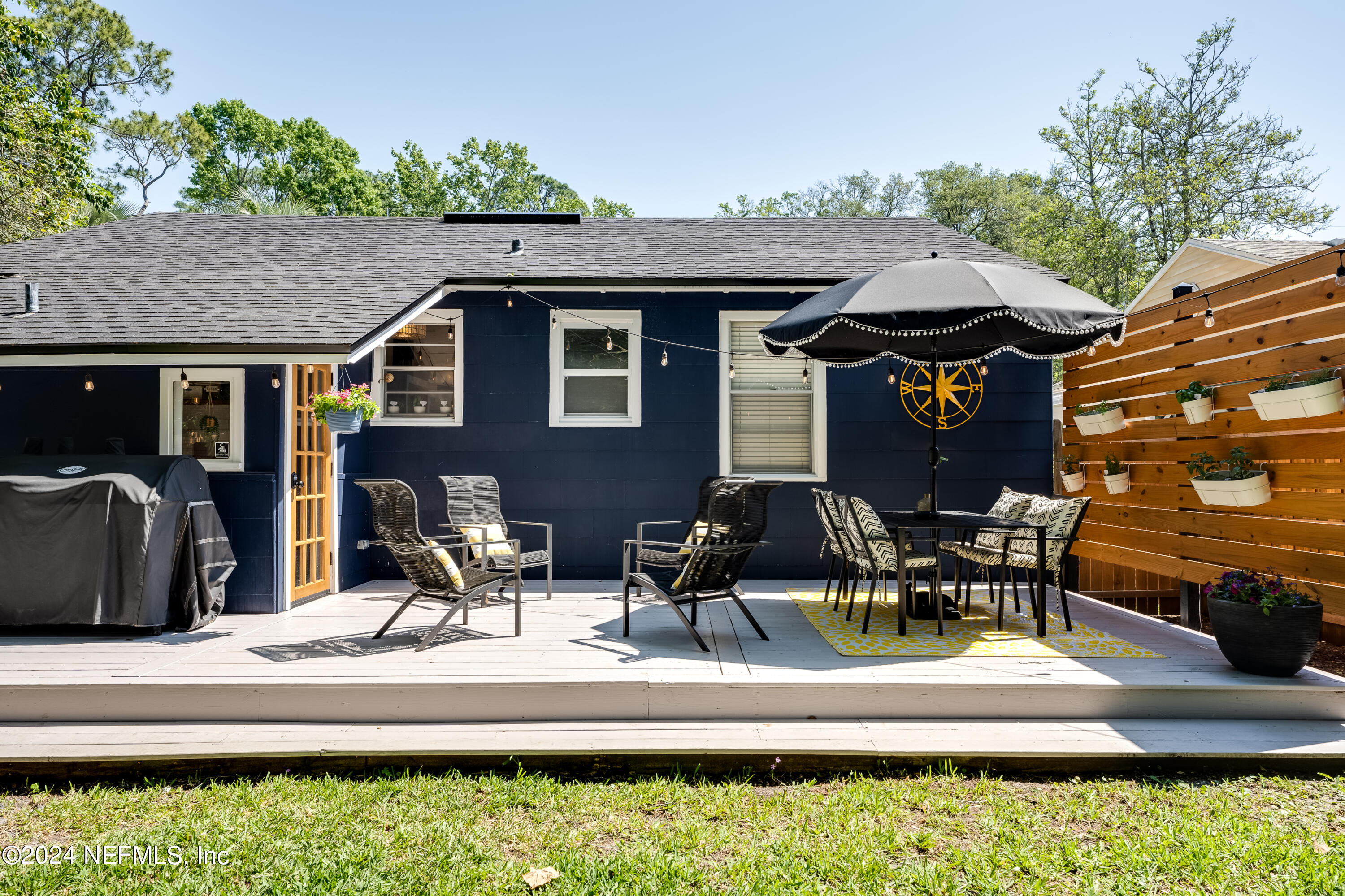 1322 Rensselaer Avenue Jacksonville, FL 32205 - Photo 28 of 37 a patio with table and chairs