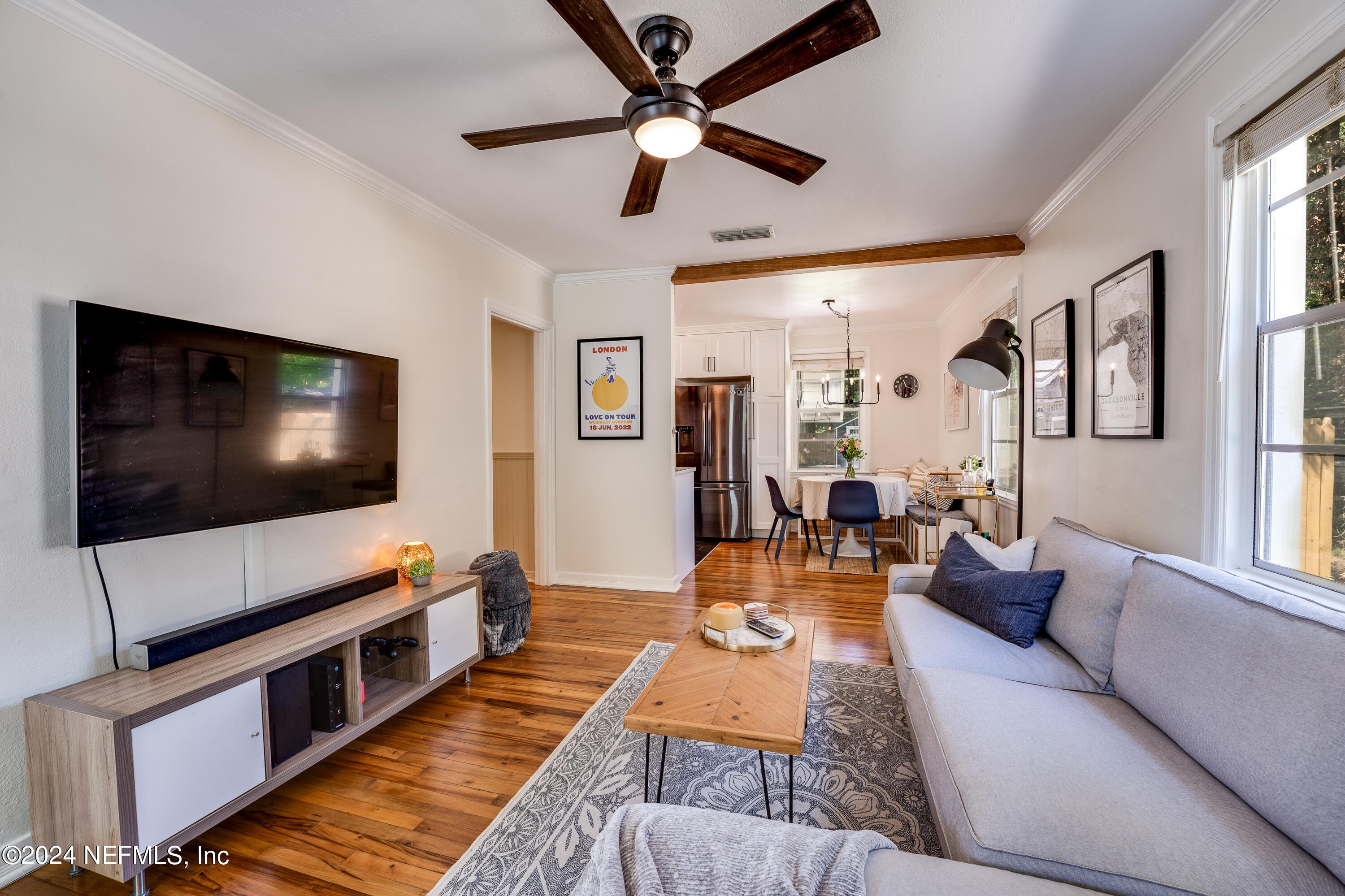 1322 Rensselaer Avenue Jacksonville, FL 32205 - Photo 8 of 37 a living room with furniture and a flat screen tv