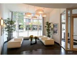 a room with gym equipment and large window