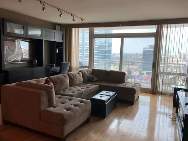 a living room with furniture and a large window